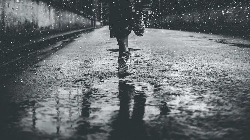 A woman running in the rain 